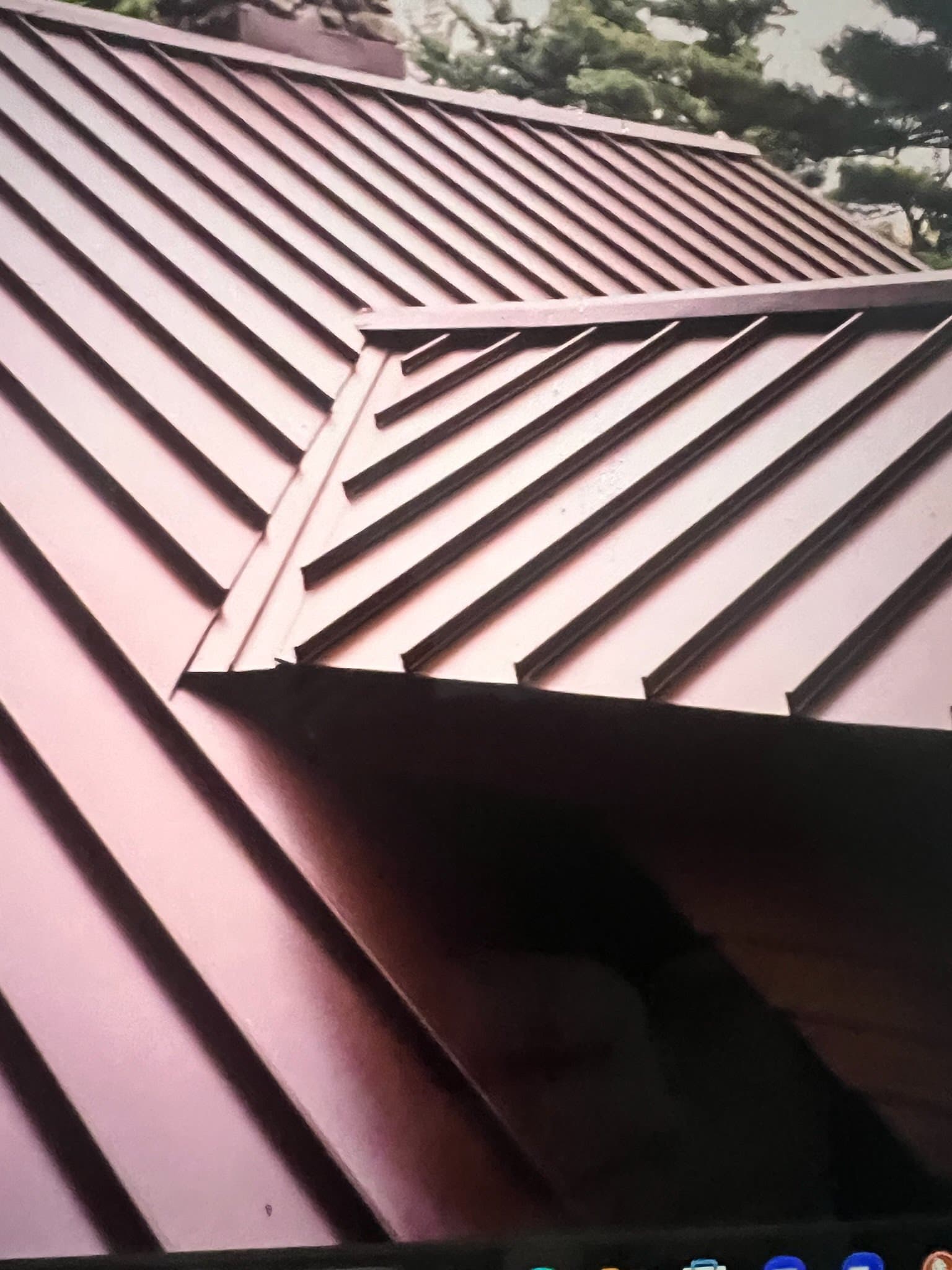 A standing seam metal roof with joined panels