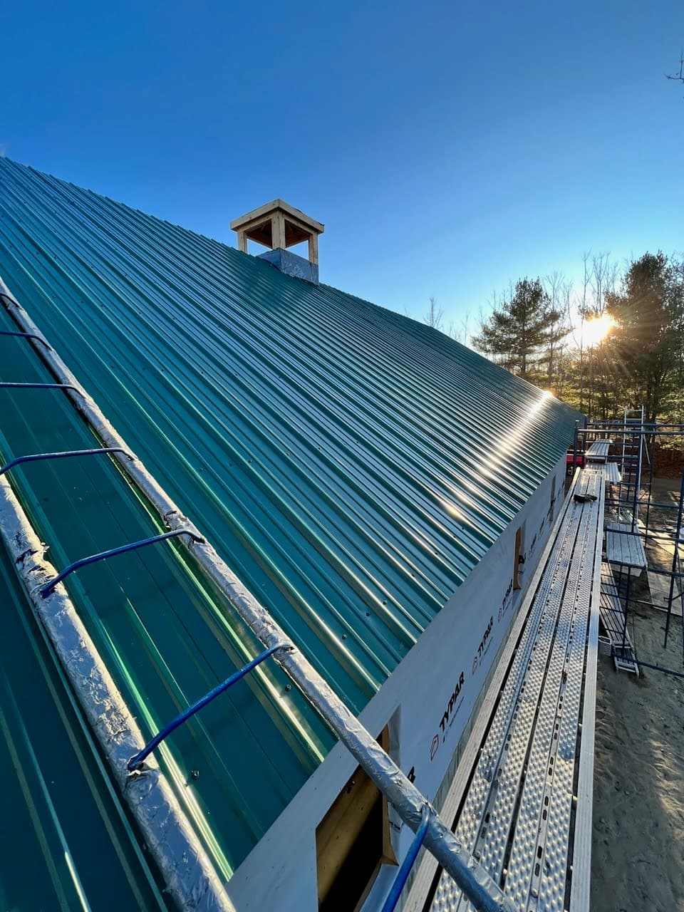 A green standing seam metal roof