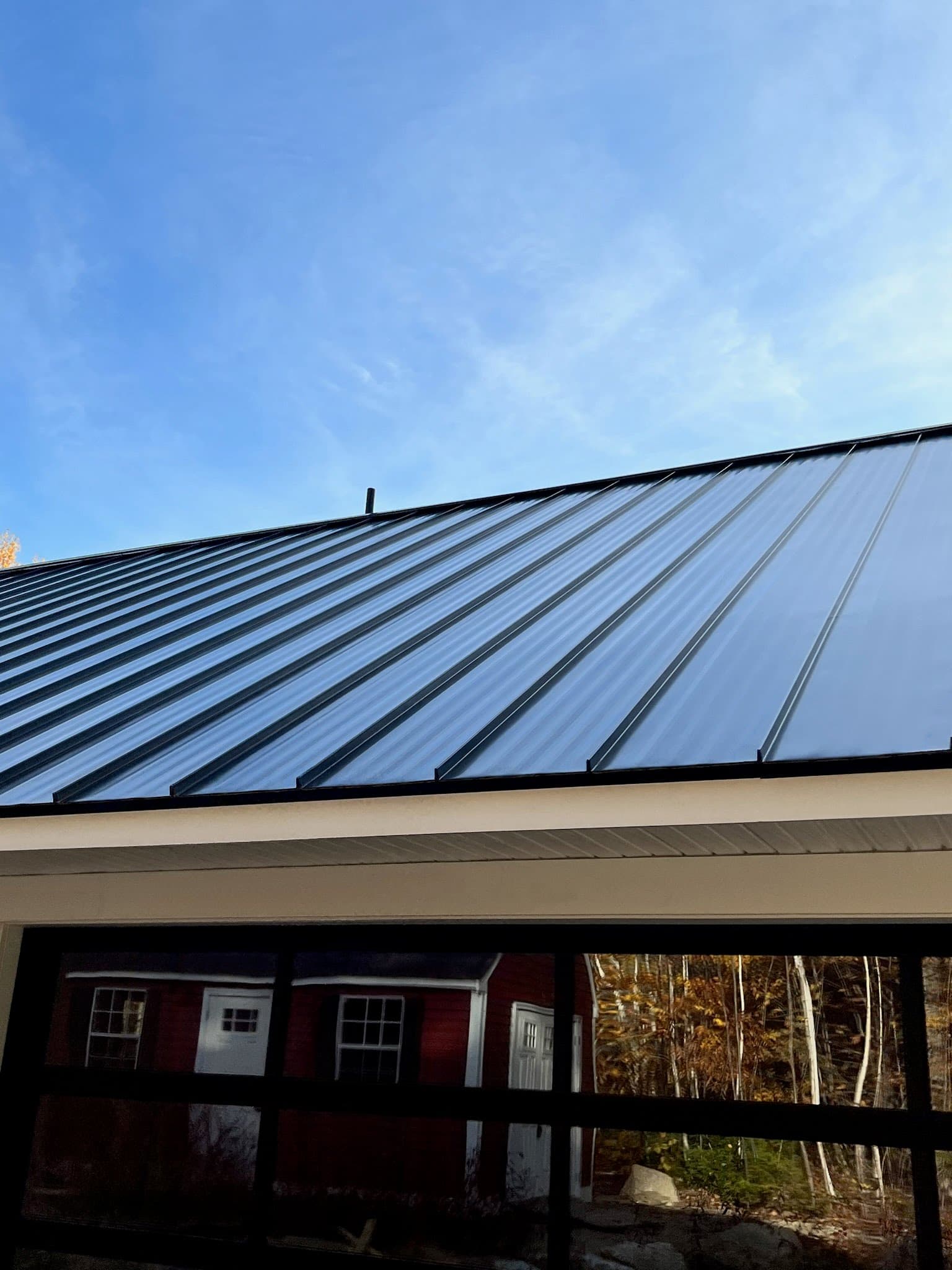 A standing seam metal roof gleaming in the sun